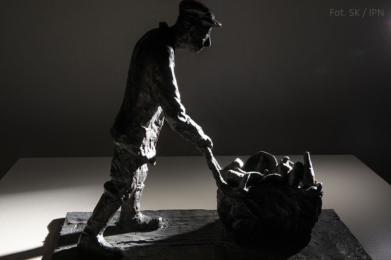 AN INMATE COLLECTING BOTTLES , BRONZE 2000