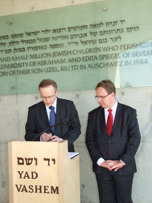 Signing in the commemoration book at the Children's Memorial