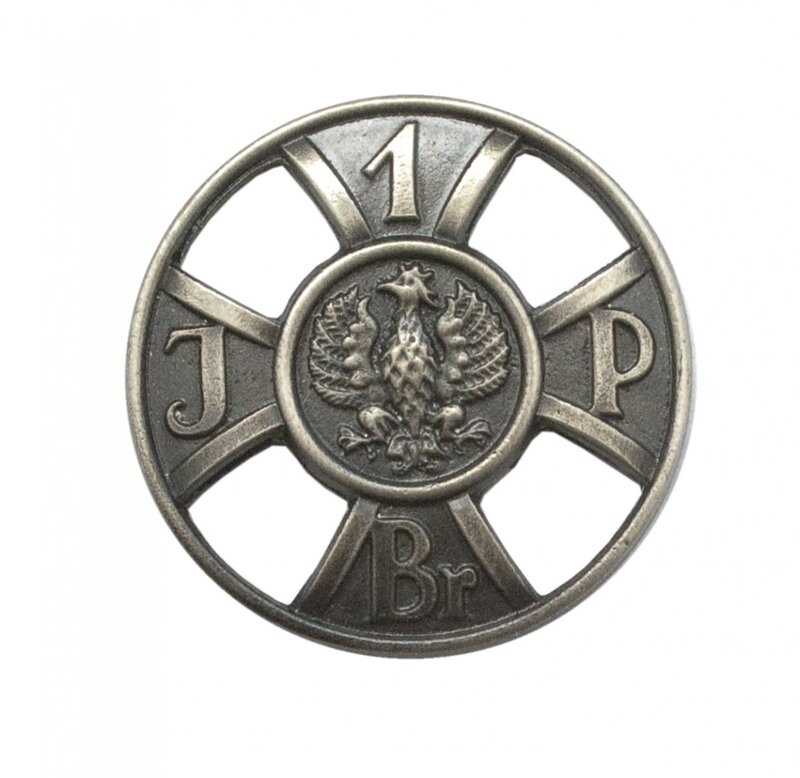 The pin modelled on the "For Faithful Service”  badge of the First Brigade  issued on the centenary of Poland regaining independence